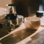 A cup of coffee sitting on top of a wooden table